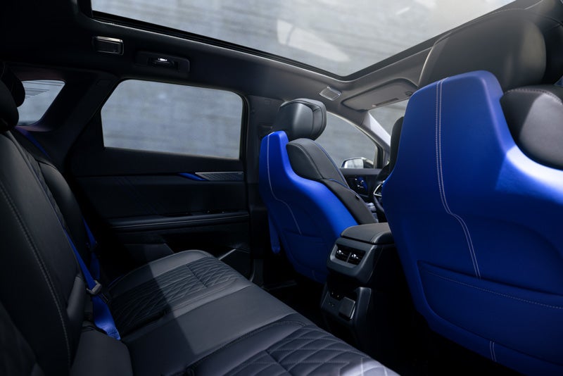 Back Seat View of the 2026 OPTIQ-V Blue Front Seats, Sun Roof, and Interior | Paul Conte Cadillac in Freeport NY
