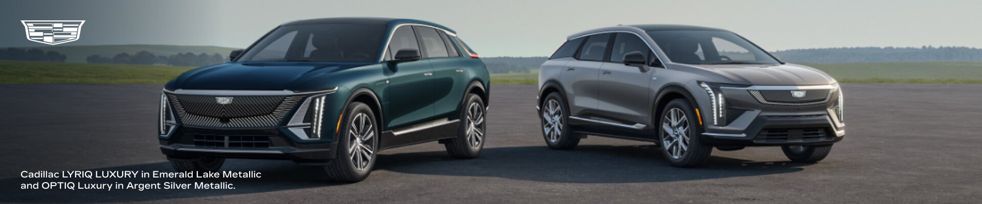 Cadillac 2026 LYRIQ LUXURY in Emerald Lake Metallic and the 2026 OPTIQ Luxury in Argent Silver Metallic.